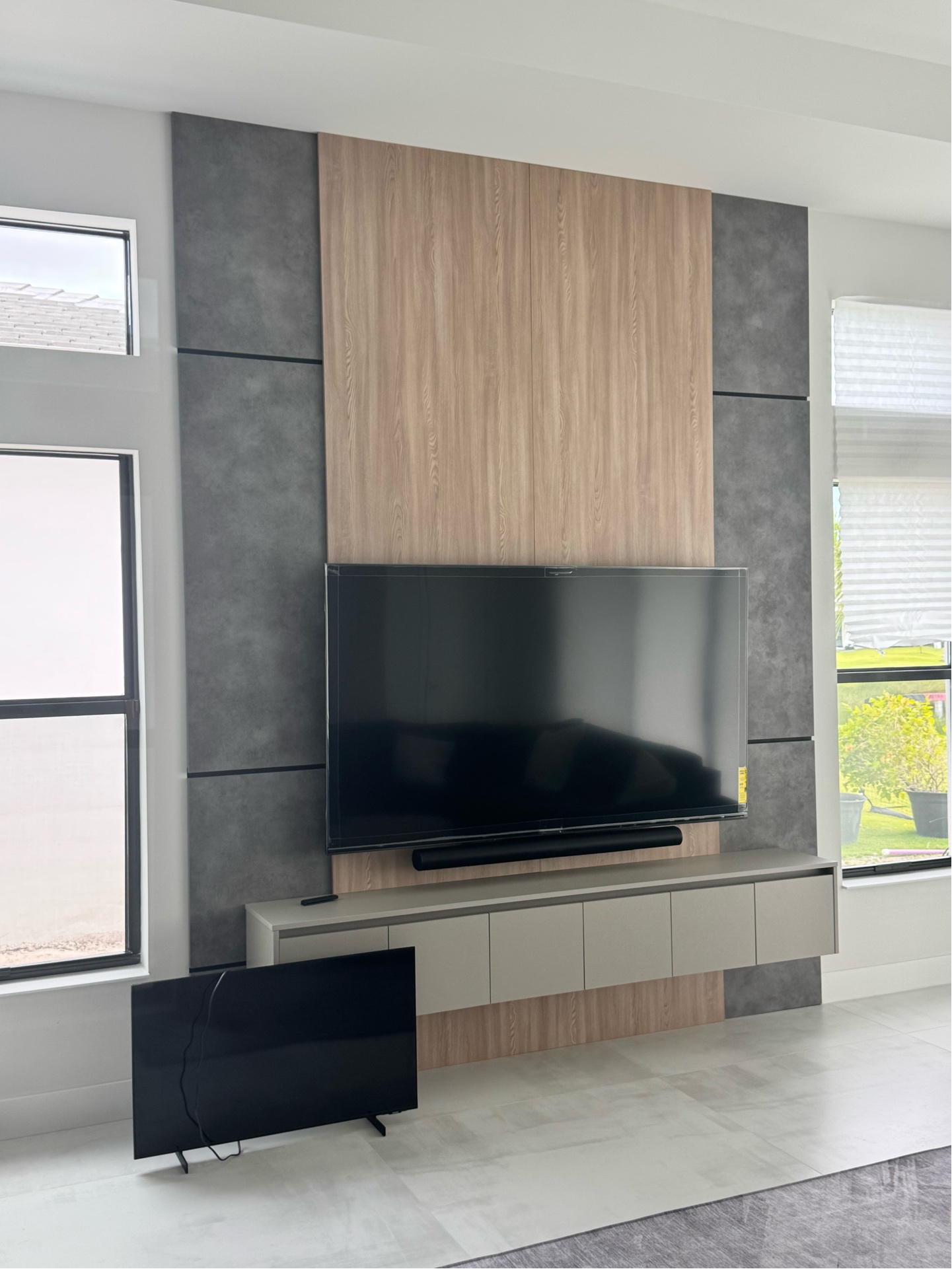 Completed TV wall with mounted TV and premium panels